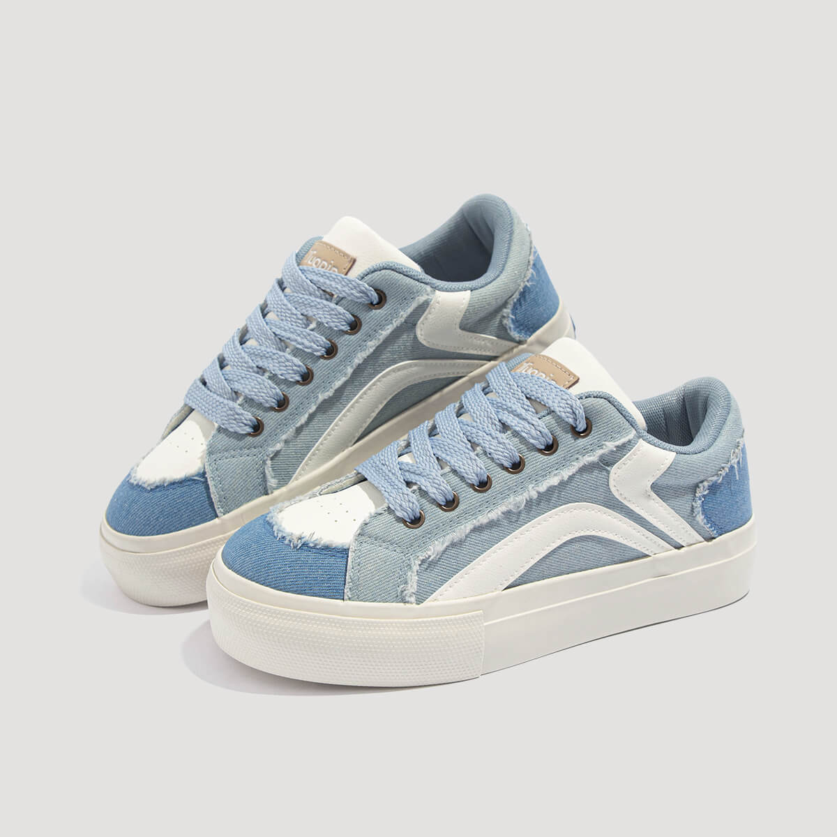 Laguna Women's Denim Platform Sneakers in Denim Blue, angled view of pair