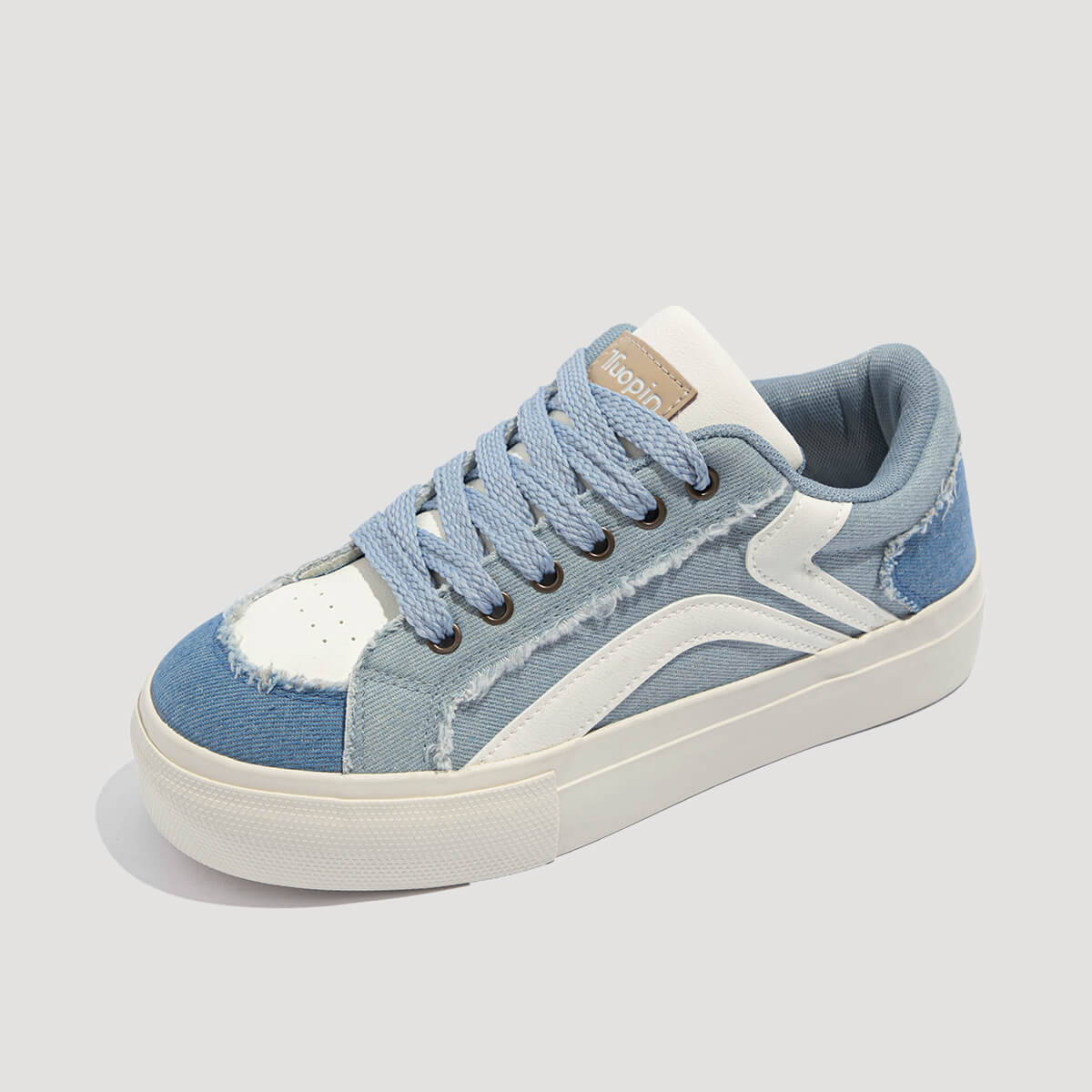 Laguna Women's Denim Platform Sneakers in Denim Blue, angled view of shoe